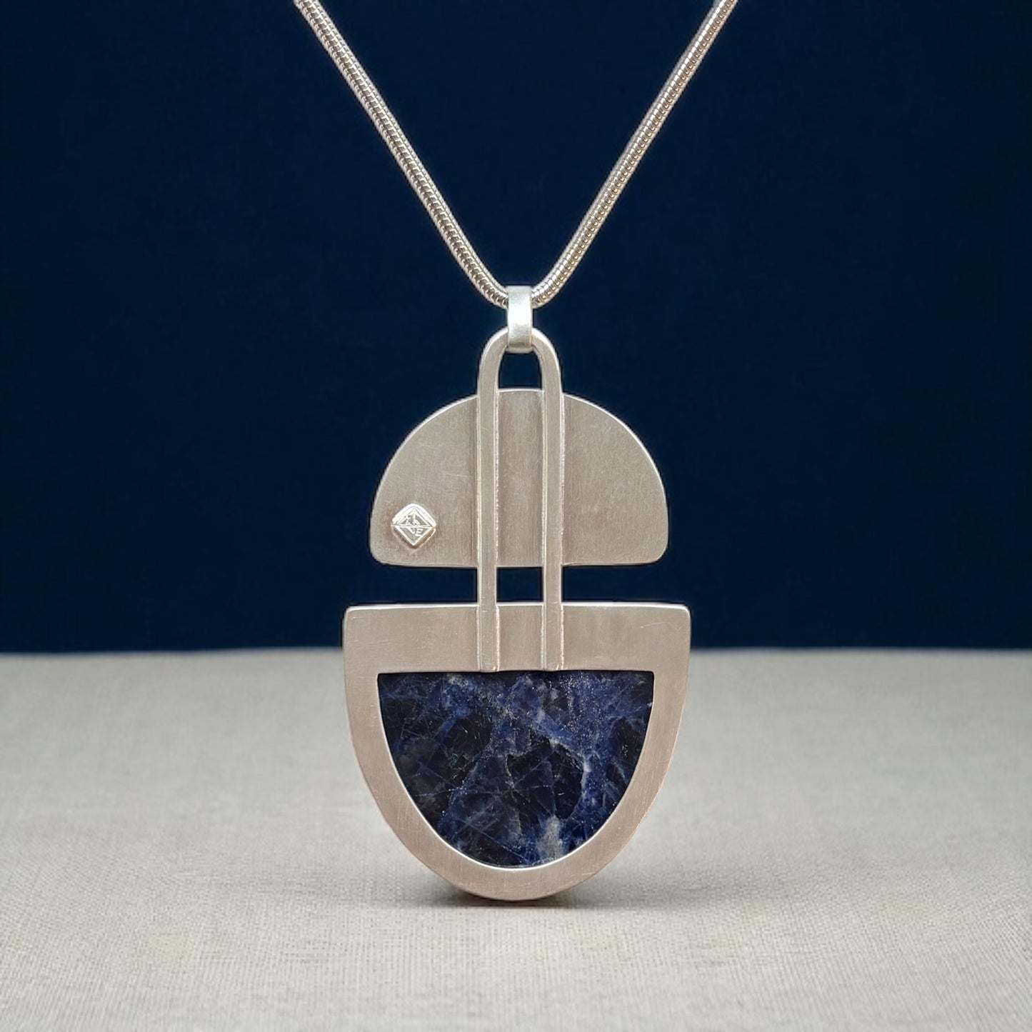 Silver & Sodalite Pendant Accented with Brass